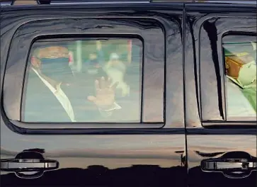  ?? Alex Edelman AFP/ Getty I mages ?? PRESIDENT TRUMP waves Sunday as his motorcade drives past supporters outside Walter Reed medical center in Bethesda, Md. His treatment for COVID- 19 includes taking a steroid, signaling lung damage.