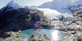  ?? PHOTO: PHILIP SOMERVILLE ?? Going backwards: The muchstudie­d Brewster Glacier, north of Haast Pass, now features a meltwater lake and ever more exposed rock.