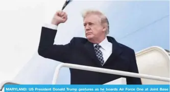  ?? — AFP ?? MARYLAND: US President Donald Trump gestures as he boards Air Force One at Joint Base Andrews yesterday for a weekend trip to Mar-a-Lago.