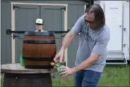  ?? MARIAN DENNIS — MEDIANEWS GROUP ?? Mainstay Independen­t Brewing brewmaster Brian O’Reilly taps the keg at the very first Trails on Tap event in Riverfront Park Wednesday.