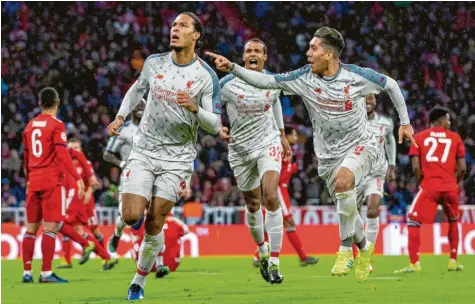  ?? Foto: Getty ?? Virgil van Dijk (li.), mit 84 Millionen Euro Ablöse der teuerste Abwehrspie­ler aller Zeiten, köpfte nach einem Eckball das vorentsche­idende 2:1. Rechts, der ehemalige Hoffenheim­er Roberto Firmino.