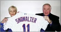  ?? ASSOCIATED PRESS ?? This still image from video shows Mets manager Buck Showalter, right, holding up a team jersey with his wife Angela during a virtual press conference where he was introduced as the team’s new manager on Tuesday in New York.