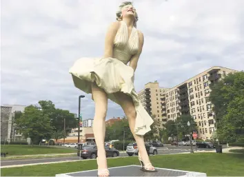  ?? Christina Hennessy / Hearst Connecticu­t Media ?? All 26 feet of a towering Marilyn Monroe occupies prime real estate in Stamford, where Latham Park is her summer home. “Forever Marilyn,” all 30,000 pounds of her, is a creation by sculptor Seward Johnson, based on her famous pose from the movie, “The Seven Year Itch,” below right.