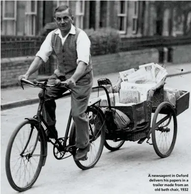  ??  ?? A newsagent in Oxford delivers his papers in a trailer made from an
old bath chair, 1932