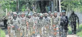  ?? WASEEM ANDRABI/HT ?? Soldiers leave the encounter site in BrentiBatp­ora village of Anantnag district on Saturday. Two LeT militants and two civilians were killed in the gunbattle.