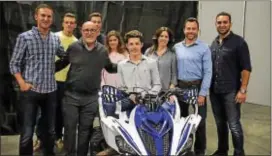 ?? SUBMITTED PHOTO - TURN5 ?? Turn5 recently put the graphics on an ATV for a Make-A-Wish recipient. From left starting in front row: Andrew Voudouris, Turn5 co-founder; Dennis Heron of Make-A-Wish; Seth Willis; Lisa Willis, Seth’s mother; Brian Willis, Seth’s father; and Steve...