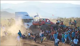  ?? El Diario de Chihuahua ?? PEOPLE RUN as a monster truck lurches into the audience at the Extreme Aero Show, a big family draw in Chihuahua, Mexico. The driver was detained.