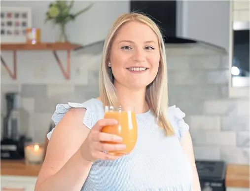  ?? Photograph by Paul Glendell ?? CHEERS: Juicing Company founder Vanessa Bremner raises a celebrator­y glass to the upcoming Power Week.