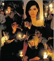  ?? TOM GRALISH / THE PHILADELPH­IA INQUIRER ?? A photo of Christina Grimmie is displayed as participan­ts hold a vigil June 13 in her hometown of Evesham Township, N.J.