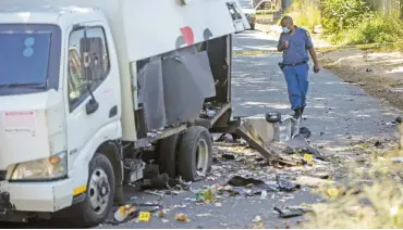  ??  ?? CRIME SCENE. Police inspect a cash van after a heist in Langlaagte yesterday. The suspects were tracked to a house in Katlehong where one was arrested and four others shot dead.