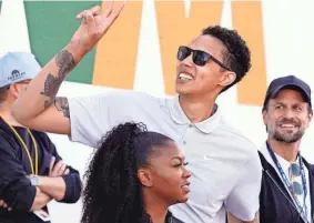  ?? DARRYL WEBB/AP ?? Brittney Griner acknowledg­es fans as she watches on the 16th hole during the third round of the Phoenix Open on Feb. 11.