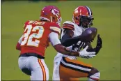  ?? JEFF ROBERSON — THE ASSOCIATED PRESS ?? Kansas City Chiefs safety Tyrann Mathieu, left, breaks up a pass intended for Cleveland Browns wide receiver Jarvis Landry, right, during the second half of a divisional-round game Sunday, Jan. 17, in Kansas City.