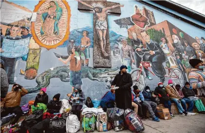  ?? Andres Leighton/Associated Press file photo ?? Migrants camp on a street in downtown El Paso in December 2022. Christian voters and faith leaders have long been on the front lines of providing assistance to migrants, but views diverge on policies, from border security to legalizati­on options.