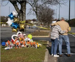  ?? BILLY SCHUERMAN - VIA THE ASSOCIATED PRESS ?? A memorial outside of the Chesapeake, Va., Walmart on Thursday. Andre Bing, a Walmart manager, opened fire on fellow employees, killing six people.