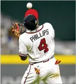  ?? MIKE ZARRILLI / GETTY IMAGES ?? One of this season’s candidates atthird base was Brandon Phillips, normally a second baseman. Phillips is among six Braves to appear at third base in at least 10 games this season — and one of 17 to play there since 2013.