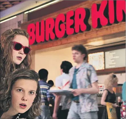  ?? Netf lix ?? MAX (Sadie Sink, top left) and Eleven (Millie Bobby Brown) scope things out at the shiny, new Starcourt Mall in “Stranger Things 3.”