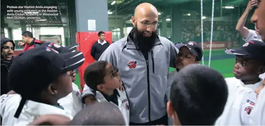  ??  ?? Proteas star Hashim Amla engaging with young cricketers at the Hashim Amla Cricket Academy in Westwood Mall, Durban, yesterday.
