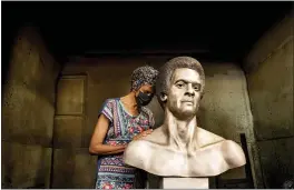  ?? NOAH BERGER — THE ASSOCIATED PRESS ?? Fredrika Newton, widow of Black Panther Party co-founder Huey Newton, touches a bust of her late husband at Artworks Foundry in Berkeley on Tuesday. The bust is scheduled to be unveiled in Oakland on Sunday.