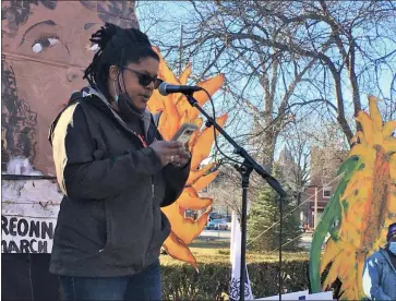  ?? DIANE PINEIRO-ZUCKER — DAILY FREEMAN ?? Above, Callie Jayne of Rise Up Kingston speaks during the rally Saturday on Academy Green in Kingston, N.Y. Right, attendees at the rally listen to speakers.