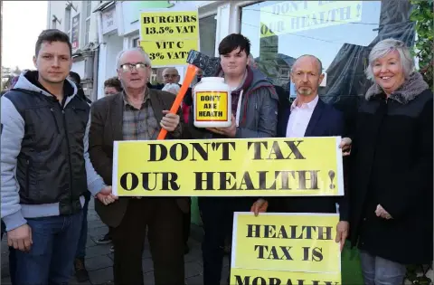  ??  ?? Tamas Giran, David Kidd, Patrick Devereux, Matt Ronan and Nuala Ronan at the Health Food Tax protest at Evolv, Castle Hill on Friday.