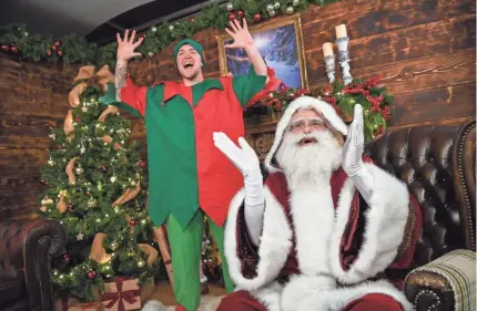  ?? FINNBARR WEBSTER/GETTY IMAGES ?? Santa Claus and his elf Pipkin talk to children on Zoom on Nov. 27 in Newquay, England.