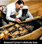  ?? ?? Howard Carter’s delicate handling of Tut’s inner sarcophagu­s.