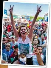  ??  ?? PASSION PASSION: A Af female l I Iranian i f fan cheers h (left) as Russians celebrate (above)