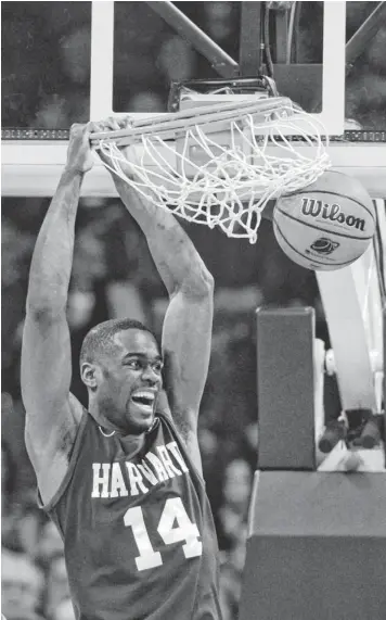  ?? KIRBY LEE, USA TODAY SPORTS ?? Harvard’s Steve Moundou-Missi dunks for two of his nine points in Thursday’s win against Cincinnati. He also played a key role in the Crimson holding the Bearcats’ inside game in check.