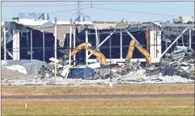  ?? Tim Vizer/aFP via Getty Images/Tns ?? Recovery operations continue after the partial collapse of an Amazon Fulfillmen­t Center in Edwardsvil­le, Illinois, on Dec. 12. The facility was damaged by a tornado on Dec. 10. The confirmed number of fatalities has been raised from two to six people.