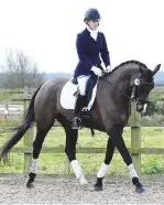  ??  ?? Jenny Lo-Vel pilots Holywell Cavaliere Classic to victory at both novice and elementary