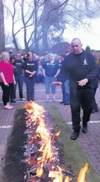  ??  ?? Firewalk fun at East Cheshire Hospice in 2015