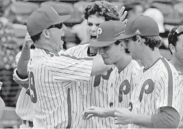  ?? CHARLES TRAINOR JR ctrainor@miamiheral­d.com ?? Monsignor Pace’s Tom Duffin, left — celebratin­g with players at a state semifinal in 2018 — has been the school’s head baseball coach since 1999. He says he’ll step down after this season to spend more time with his family but plans to continue as athletic director.