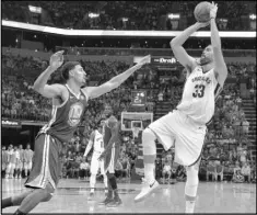  ?? Brandon Dill The Associated Press ?? Memphis Grizzlies center Marc Gasol (33) shoots against Golden State Warriors guard Klay Thompson (11) during the second half on Saturday in Memphis, Tenn.