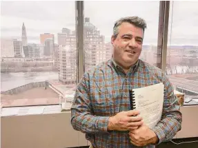  ?? Dan Haar / Hearst Connecticu­t Media file photo ?? John DiIorio, founder and CEO of 1st Alliance Lending in East Hartford, in his office overlookin­g downtown Hartford. He is fighting an effort by the state to shut down his company for mortgage loan activity he says is legal.