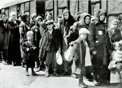  ??  ?? Hungarian Jews arriving at Auschwitzb­irkenau, June 1944; Susan as a young girl, before she was taken to the camp