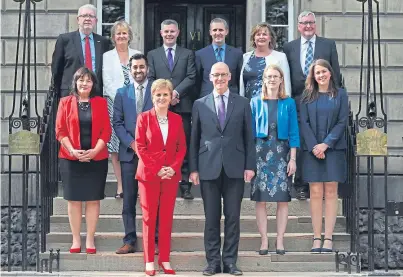 ?? Picture: PA. ?? First Minister Nicola Sturgeon and Deputy First Minister John Swinney, front, with the new Cabinet, from left, back: Mike Russell, Roseanna Cunningham, Derek Mackay, Michael Matheson, Fiona Hyslop and Fergus Ewing; centre: Jeane Freeman, Humza Yousaf, Shirley-Anne Somerville and Aileen Campbell.