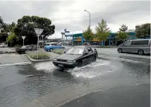  ??  ?? The Vanguard St-Rutherford St intersecti­on was also swamped by the tide.