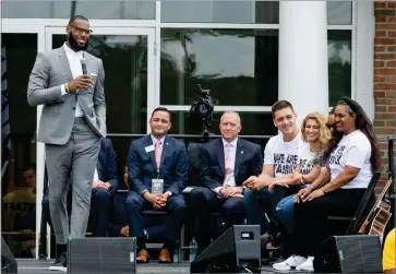  ?? AP PHOTO BY PHIL LONG ?? Lebron James gets a laugh from his mother, Gloria, right, and other officials at the opening ceremony for the I Promise School in Akron, Ohio, Monday, July 30.