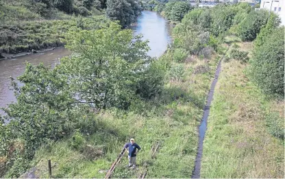  ??  ?? The overgrown railway lines at Leven. A correspond­ent adds to the calls to get the rail service back in operation and improve Levenmouth’s accessibil­ity to surroundin­g areas.