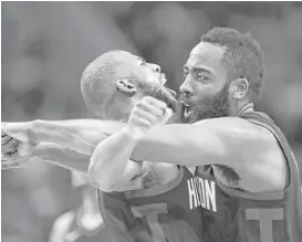  ?? Karen Warren photos / Houston Chronicle ?? Guards Chris Paul, left, and James Harden celebrate after one of Harden’s 3-pointers during the second half Monday night.