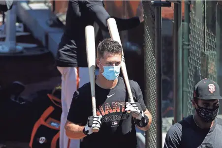  ?? JEFF CHIU/AP ?? San Francisco’s Buster Posey announced his decision to skip this year after finalizing the adoption of identical twin girls this week. The babies were born prematurel­y and Posey said after consultati­ons with his wife and doctor he decided to opt out of the season.