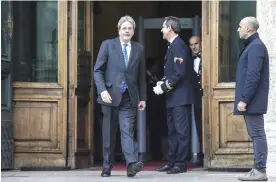  ?? — AP ?? ROME: Paolo Gentiloni, left, leaves the Italian lower Chamber yesterday.