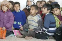  ?? — Reuters ?? Students attend a class at the Aisha Mother of the Believers school which was recently reopened after rebels took control of Al Rai town from IS militants in Syria.