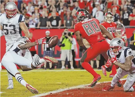  ?? STAFF PHOTO BY MATT STONE ?? CLOSE CALL: Cornerback Jonathan Jones breaks up a pass to Bucs tight end O.J. Howard on the final play of the game to preserve the Pats’ win last night in Tampa.