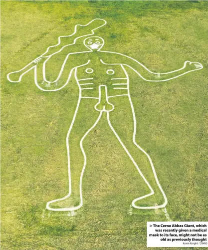  ?? Kevin Knight / SWNS ?? The Cerne Abbas Giant, which
was recently given a medical mask to its face, might not be as
old as previously thought