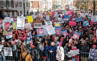  ?? Craig Ruttle / Associated Press ?? People line up on Central Park West as they wait for the start of a march highlighti­ng equal rights and equality for women, the LGBT community and immigrants Saturday in New York.