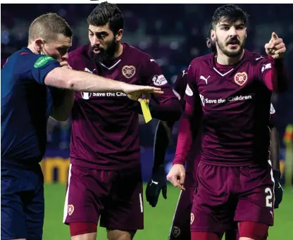  ??  ?? Yellow peril: Callum Paterson (right) was one of five Hearts players booked against Aberdeen last week
