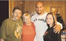  ??  ?? BROWN WITH his stepfather, mother and sister. He faced a prison sentence of 32 years to life for a two-week crime spree.