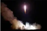  ?? JIN LIWANG / XINHUA ?? China launches the world’s first quantum satellite on top of a Long March-2D rocket from the Jiuquan Satellite Launch Center in Jiuquan on Tuesday. The satellite been given the name “Micius”, after the ancient Chinese scientist.