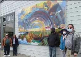  ?? PHOTOS BY MICHELLE BLACKWELL ?? Building owners Kathy and Whitey Brown, artist Ryan Grossman, sponsor Margaret Reiter and Ken Reiter dedicate Grossman’s “Be A Light” mural at a small ceremony on September 25on Redwood Avenue in Fort Bragg.